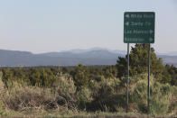 A haze of wildfire smoke hangs over the Upper Rio Grande valley and the mesa-top city of Los Alamos, N.M., on Thursday, May 12, 2022. Public schools and many businesses were closed as a wildfire crept closer to the city and companion national security laboratory. Scientists at Los Alamos National Laboratory are using supercomputers and ingenuity to improve wildfire forecasting and forest management amid drought and climate change in the American West. (AP Photo/Morgan Lee)