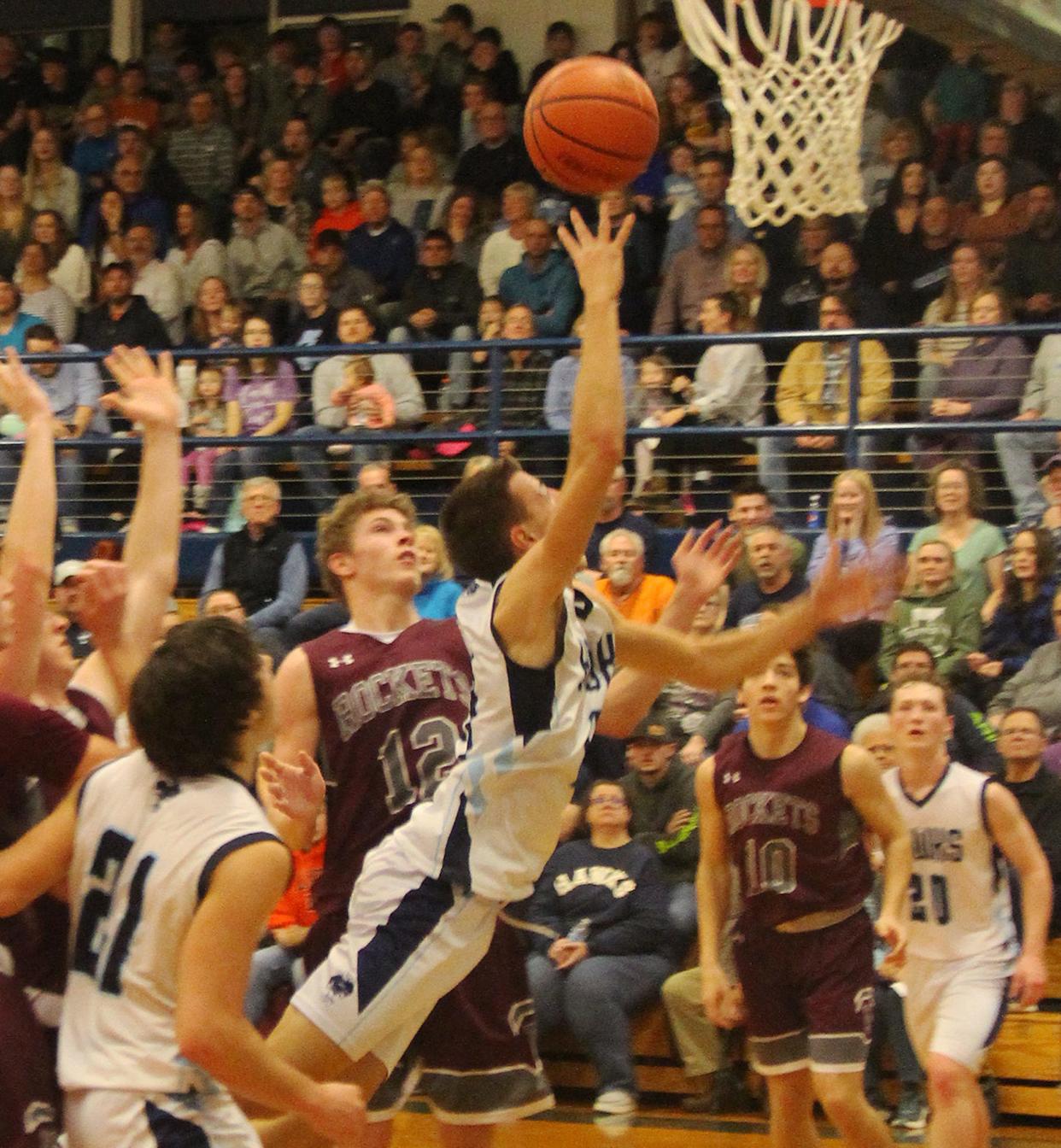 Prairie Central's Dylan Bazzell gets airborne as he leans to toss a shot at the basket Friday against Tolono. Bazzell made the shot and finished the game with 16 points. PC won 45-36.