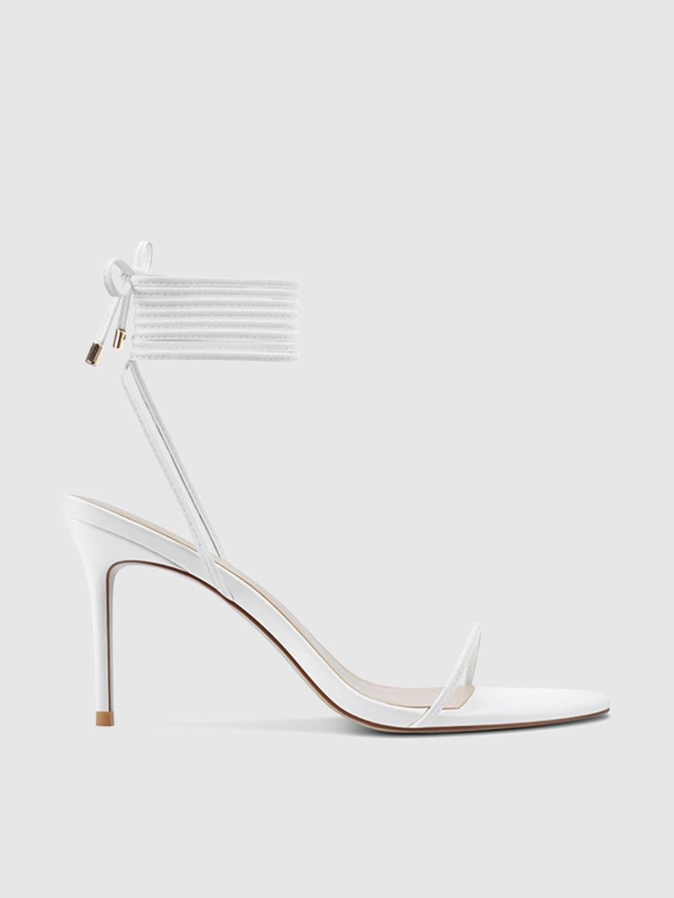 <p><a href="https://femme.la/products/3-0-barely-there-lace-up-heel-white-1" rel="nofollow noopener" target="_blank" data-ylk="slk:Shop Now;elm:context_link;itc:0;sec:content-canvas" class="link ">Shop Now</a></p><p>Barely There Lace-Up Heel</p><p>femme.la</p><p>$199.00</p>