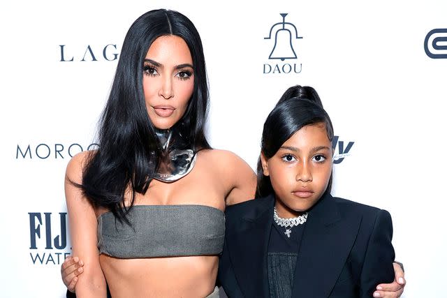 <p>Stefanie Keenan/Getty Images</p> Kim Kardashian and North West attend Front Row's fashion show