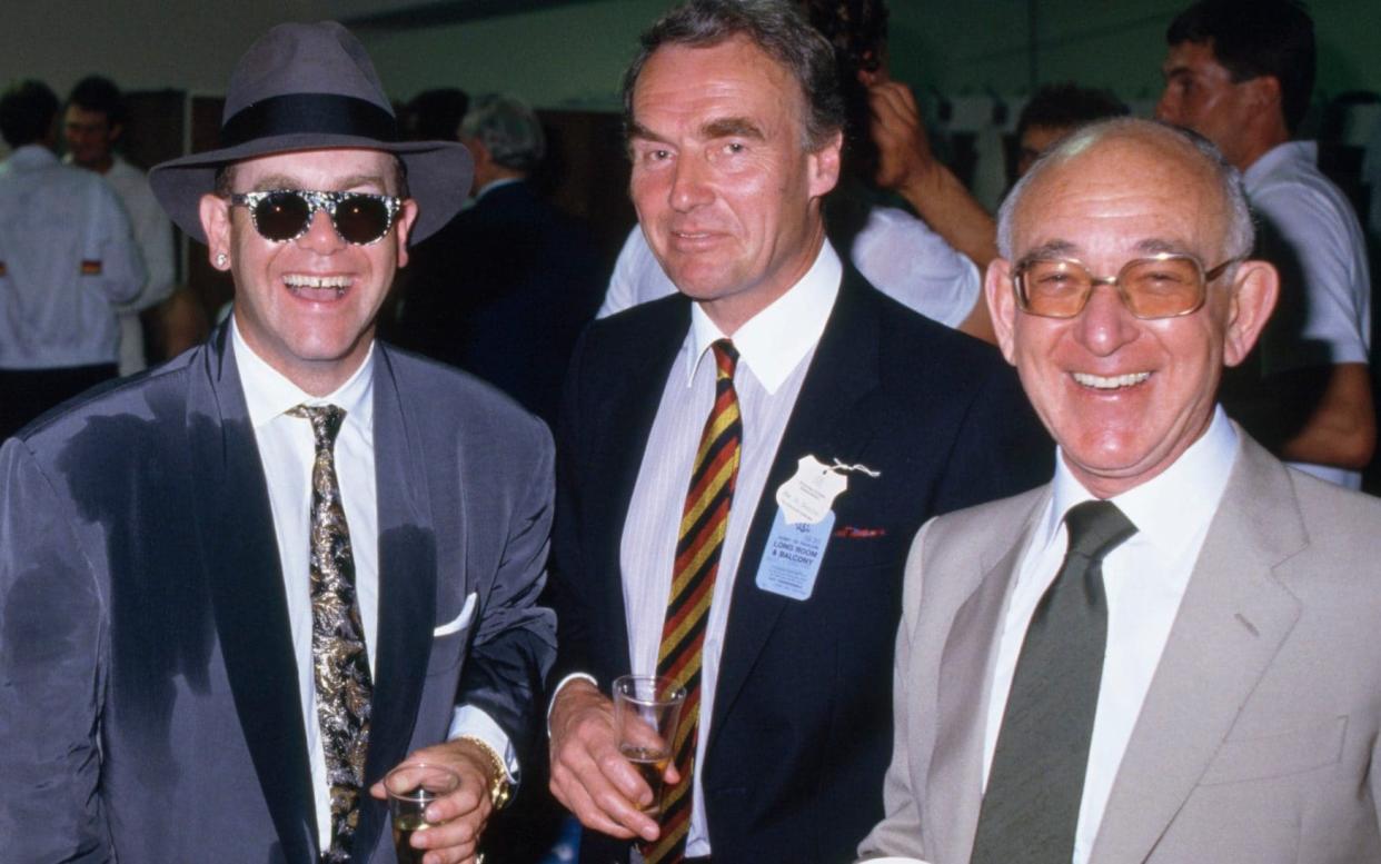 Bernie Coleman, far right, with Elton John and Alan Smith, Melbourne, 1986 - Patrick Eagar/Popperfoto via Getty Images