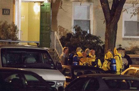 Authorities prepare to search an apartment building in Stamford, Connecticut October 4, 2013. REUTERS/ Michelle McLoughlin