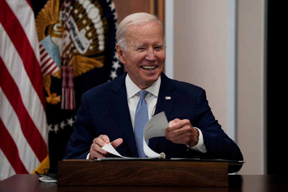 U.S. President Joe Biden reacts as he takes his seat before delivering remarks on the economy in the Eisenhower Executive Office Building's South Court Auditorium at the White House in Washington, U.S., July 28, 2022. REUTERS/Elizabeth Frantz