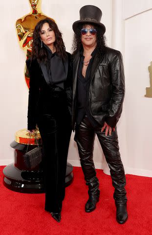 <p> Mike Coppola/Getty</p> Meegan Hodges and Slash