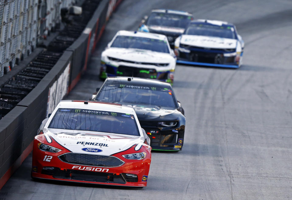 Ryan Blaney (12) leads during the NASCAR Cup Series auto race Saturday, Aug. 18, 2018, in Bristol, Tenn. (AP Photo/Wade Payne)