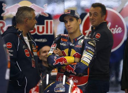 KTM Moto3 rider Luis Salom of Spain waits for the first free practice session to start at his team's garage ahead of Sunday's Japanese Grand Prix in Motegi, north of Tokyo October 25, 2013. REUTERS/Toru Hanai