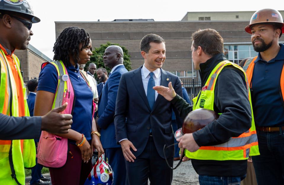U.S. Secretary of Transportation Pete Buttigieg talks with OE324 Michigan workers and Laborers Local Union 1191 workers after a news conference in Detroit on Thursday, Sept. 15, 2022. The news conference came after Buttigieg announced that the Biden-Harris administration had awarded $104.6 million to the Michigan Department of Transportation (MDOT) to help with the I-375 Improvement Project.