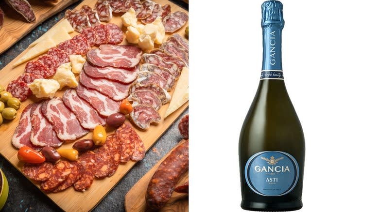 charcuterie board and sparkling wine bottle