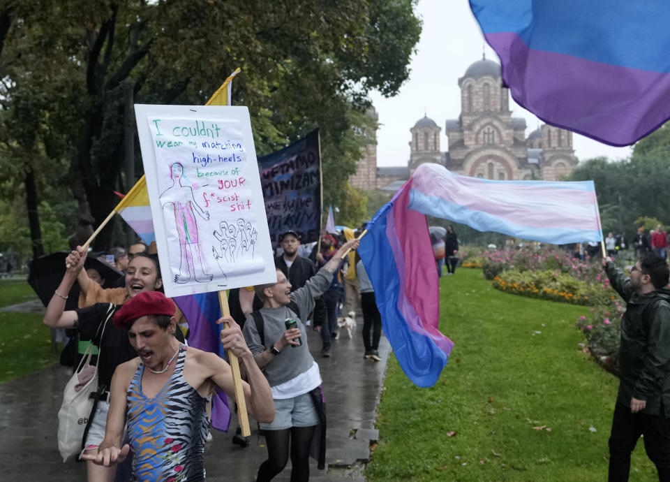 Participants take part in the European LGBTQ pride march in Belgrade, Serbia, Saturday, Sept. 17, 2022. Serbian police have banned Saturday's parade, citing a risk of clashes with far-right activists. (AP Photo/Darko Vojinovic)