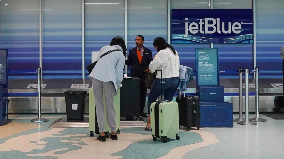 PHOTO: People check in their bags at the JetBlue Airways counter in the Fort Lauderdale-Hollywood International Airport, Jan. 31, 2024, in Fort Lauderdale, Fla.  (Joe Raedle/Getty Images)