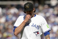 Toronto Blue Jays pitcher Kevin Gausman (34) returns to the dugout after being pulled from the mound during the sixth inning of a baseball action against the Tampa Bay Rays, Saturday, May 18, 2024, in Toronto. (Chris Young/The Canadian Press via AP)