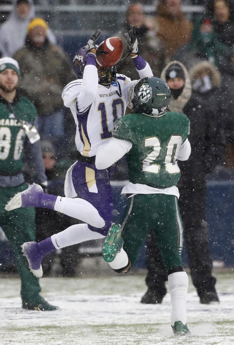 North Alabama wide receiver Dre Hall (10) catches a 38-yard pass as Northwest Missouri State defensive back Kohlman Adema-Schulte (20) defends during the first half of the NCAA Division II championship college football game Saturday, Dec. 17, 2016, in Kansas City, Kan. (AP Photo/Colin E. Braley)