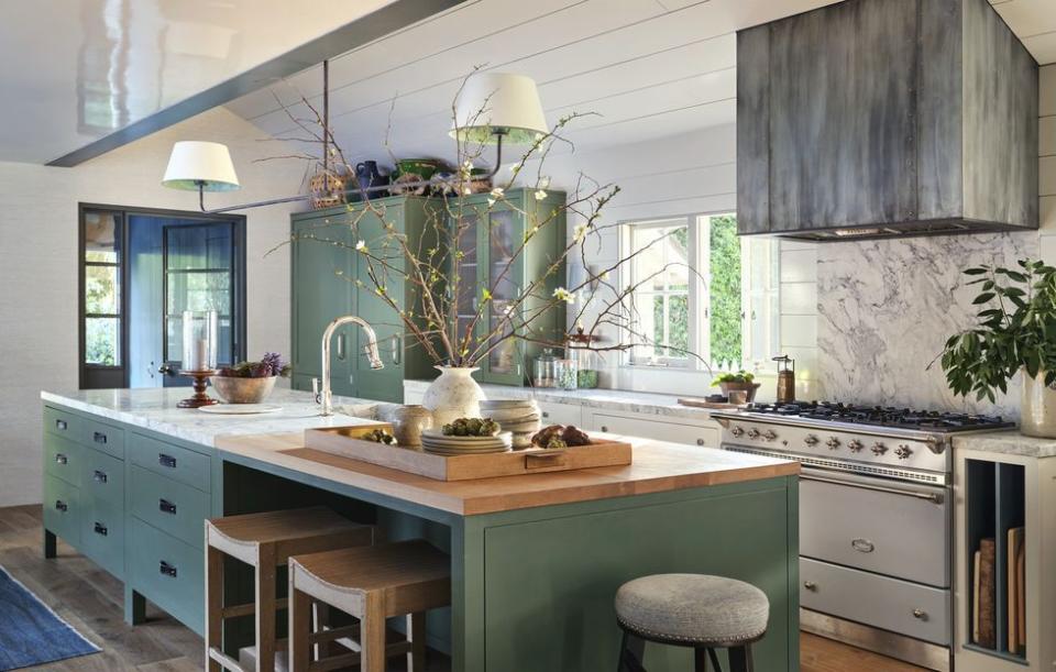 a kitchen with a table and chairs