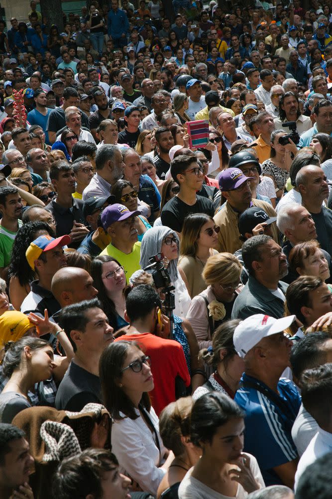 A crowd gathers to listen to opposition leader Juan Guaidó during a news conference on Jan. 25, 2019.