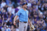 Tampa Bay Rays pitcher Jason Adam reacts after giving up a game-winning grand slam to Colorado Rockies' Ryan McMahon in a baseball game Friday, April 5, 2024, in Denver. (AP Photo/David Zalubowski)