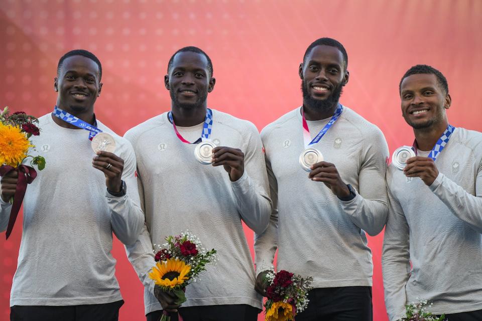 Aaron Brown, from left to right, Jerome Blake, Brendon Rodney and Andre De Grasse pose with their upgraded Tokyo Olympics silver medals during a ceremony in Langley, B.C., on July 29, 2023. THE CANADIAN PRESS/Darryl Dyck