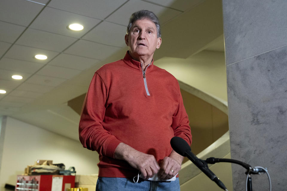 Sen. Joe Manchin, D-W.Va., responds to questions from reporters before a meeting with his fellow Democrats at the Capitol in Washington, Tuesday, Jan. 18, 2022. (AP Photo/Amanda Andrade-Rhoades)