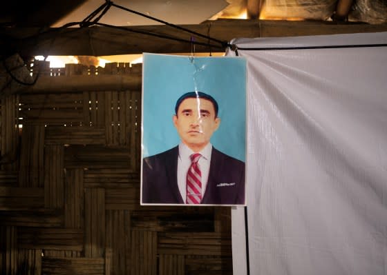 A photograph of Mohib Ullah hanging in Muhammad Zubair’s bamboo shelter, Sept. 5.<span class="copyright">Sarker Protick for TIME</span>