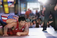 U.S. wrestler Nick Gwiazdowski (L) pins Japanese wrestler Katsutoshi Kanazawa at the "Beat The Streets" wrestling event in Times Square, New York City, U.S., May 17, 2017. REUTERS/Joe Penney