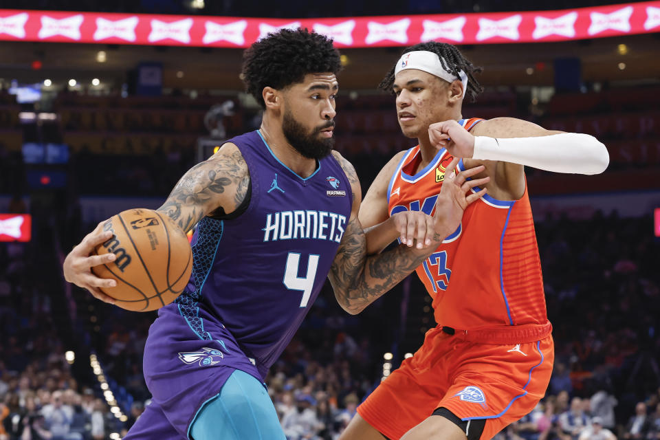 Feb 2, 2024; Oklahoma City, Oklahoma, USA; Charlotte Hornets center <a class="link " href="https://sports.yahoo.com/nba/players/6434/" data-i13n="sec:content-canvas;subsec:anchor_text;elm:context_link" data-ylk="slk:Nick Richards;sec:content-canvas;subsec:anchor_text;elm:context_link;itc:0">Nick Richards</a> (4) drives to the basket against Oklahoma City Thunder forward Ousmane Dieng (13) during the second half at Paycom Center. Mandatory Credit: Alonzo Adams-USA TODAY Sports
