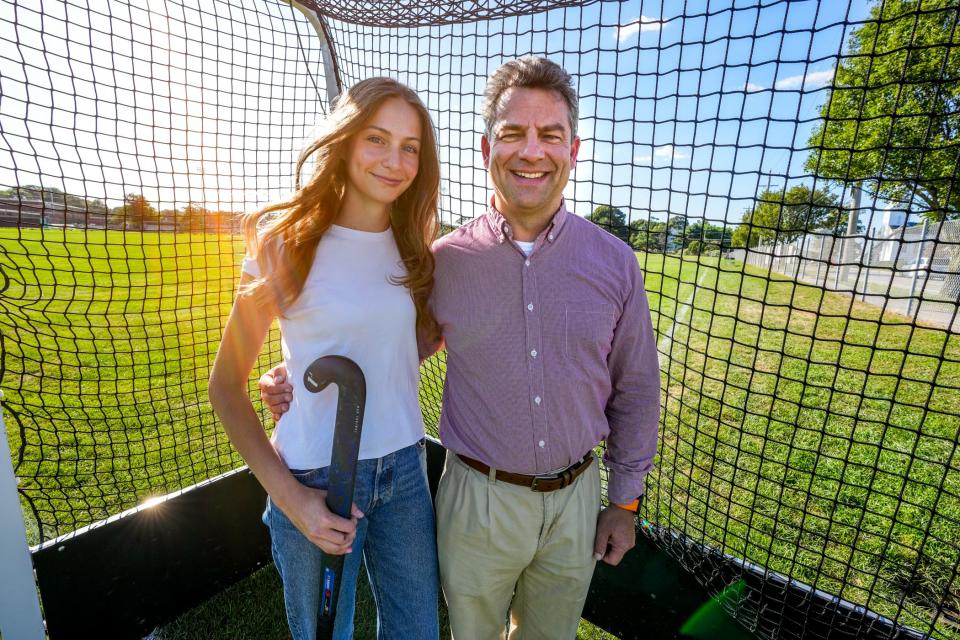 Emma Mueller and her father, Marian Mueller, who played for USA Masters Division field hockey team that took part in the World Cup in South Africa.