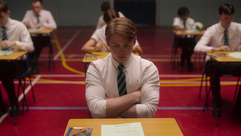 Nick starring at a GCSE paper in Heartstopper season 2 episode 3