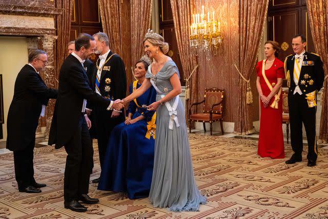 <p>Alamy Live News</p> Queen Letizia of Spain smiles besideQueen Maxima of the Netherlands before the state banquet at the Royal Palace in Amsterdam on April 17, 2024.