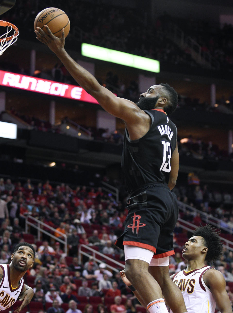 Houston Rockets guard James Harden (13) drives to the basket past Cleveland Cavaliers guard Collin Sexton, right, during the first half of an NBA basketball game Friday, Jan. 11, 2019, in Houston. (AP Photo/Eric Christian Smith)