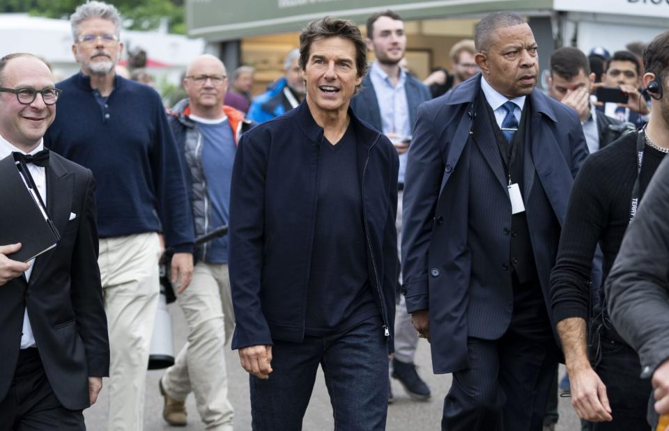 WINDSOR, ENGLAND - MAY 15: Tom Cruise arrives for the "A Gallop Through History" performance as part of the official celebrations for Queen Elizabeth II's Platinum Jubilee at Home Park on May 15, 2022 in Windsor, England. The Royal Windsor Horse Show continued the Platinum Jubilee celebrations with the A Gallop Through History event. Each evening, the Platinum Jubilee celebration saw over 500 horses and 1,000 performers create a 90-minute production that took the audience on a gallop through history from Elizabeth I to the present day. (Photo by Mark Cuthbert/UK Press via Getty Images)