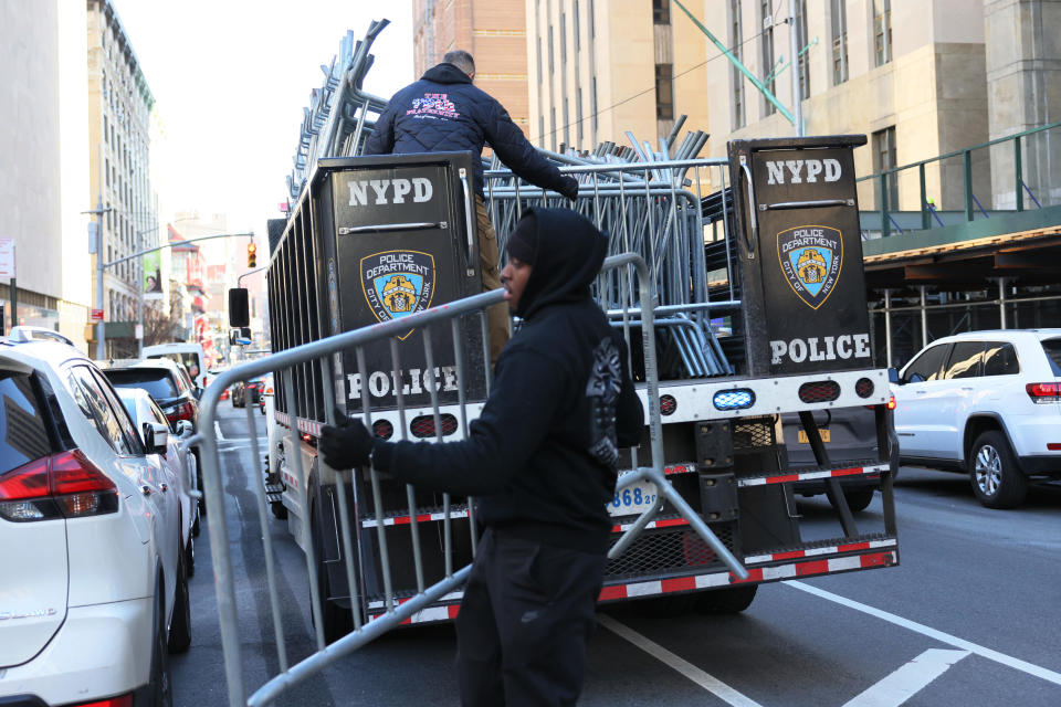 NYPD drop off metal barricades in front of Manhattan Criminal Court on March 20, 2023 in New York City.  / Credit: Michael M Santiago/Getty Images / Getty Images