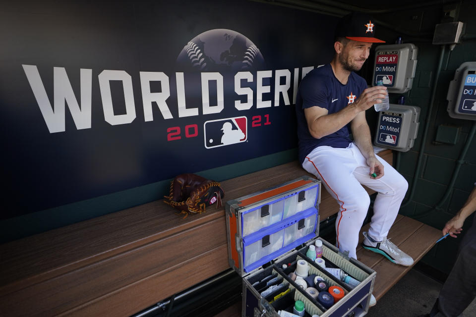 Houston Astros third baseman Alex Bregman sits in the dugout during batting practice Monday, Oct. 25, 2021, in Houston, in preparation for Game 1 of baseball's World Series tomorrow between the Houston Astros and the Atlanta Braves. (AP Photo/David J. Phillip)