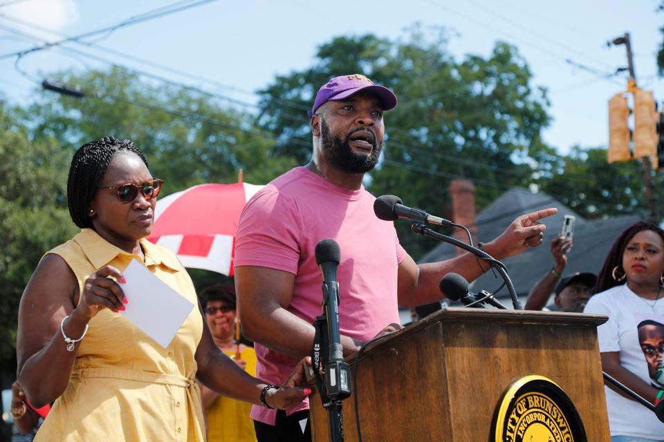 Attorney Lee Merritt speaks during a ceremony dedicating a street in honor of Ahmaud Arbery on Tuesday August 9, 2022 in Brunswick Georgia.