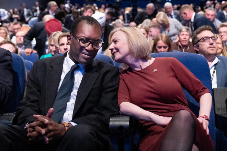 Chancellor Kwasi Kwarteng with Liz Truss at the Tory Party conference following his disastrous mini budget (Stefan Rousseau/PA) (PA Archive)