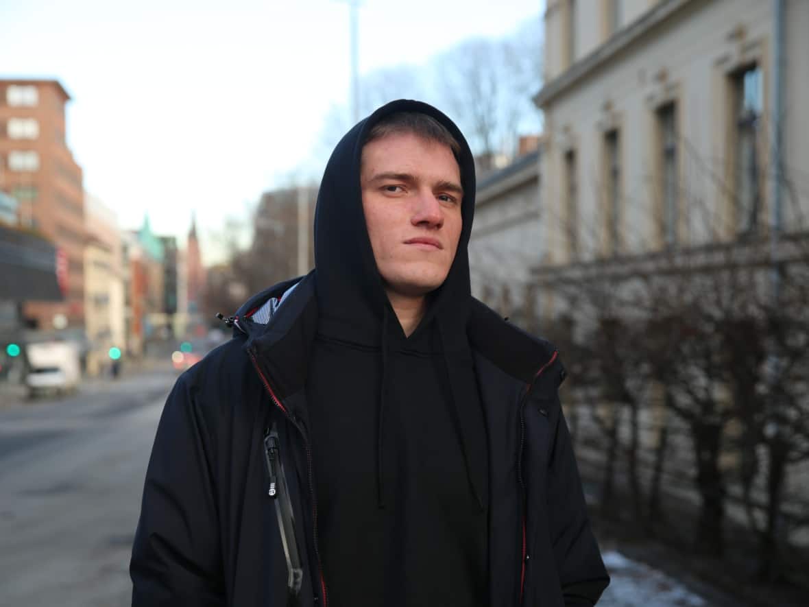Andrei Medvedev, a former mercenary in Russia's Wagner Group, stands on the street in Oslo, Norway, on Feb. 2. He says he changed his mind on Russia's invasion of Ukraine shortly after arriving there. (Corinne Seminoff/CBC - image credit)