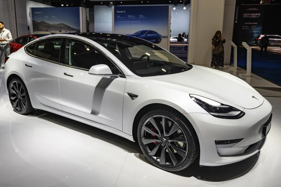 BRUSSELS, BELGIUM - JANUARY 09: Tesla Model 3 compact sedan car in white on display at Brussels Expo on January 9, 2020 in Brussels, Belgium. The Model 3 is fitted with a full self-driving system. (Photo by Sjoerd van der Wal/Getty Images)