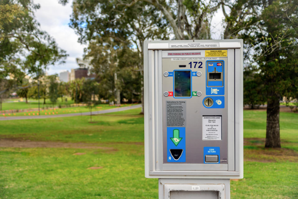 Adelaide: Parking meter  installed near St. Peter's Cathedral in Adelaide CBD with cars parked along the street