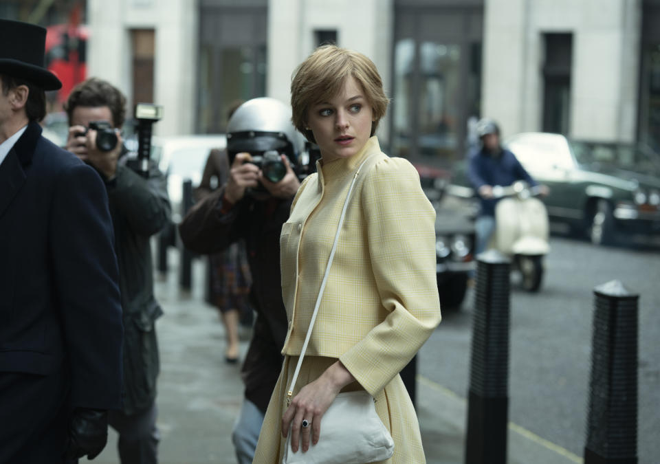 This image released by Netflix shows Emma Corrin in a scene from "The Crown." Corrin accepted the award for best actress in a television drama series at the Golden Globe Awards on Sunday, Feb. 28, 2021. (Des Willie/Netflix via AP)