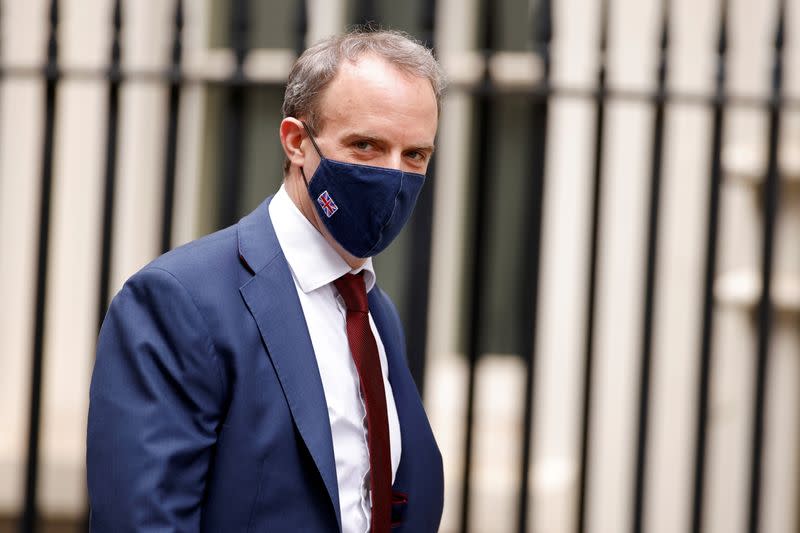 Britain's Foreign Affairs Secretary Dominic Raab walks outside Downing Street in London