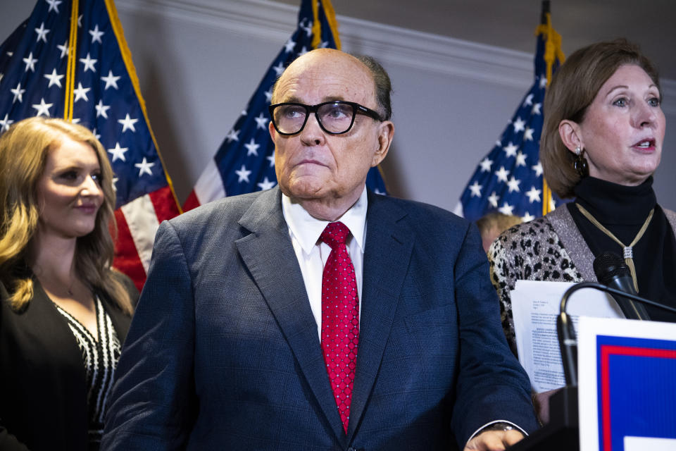 UNITED STATES - NOVEMBER 19: Rudolph Giuliani, attorney for President Donald Trump, conducts a news conference at the Republican National Committee on lawsuits regarding the outcome of the 2020 presidential election on Thursday, November 19, 2020. Trump attorneys Jenna Ellis, left,and Sydney Powell, also appear. (Photo By Tom Williams/CQ-Roll Call, Inc via Getty Images)