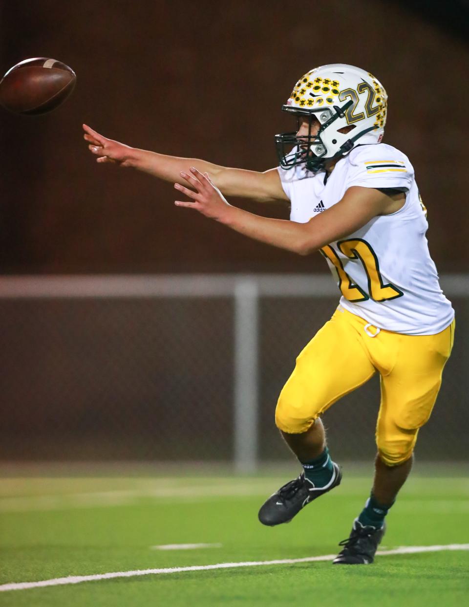 Springlake-Earth’s Roel Fuentes (22) flips the ball against Borden County during a Class 1A Division I regional championship game Friday, Nov. 20, 2020, at Tiger Stadium in Slaton, Texas.