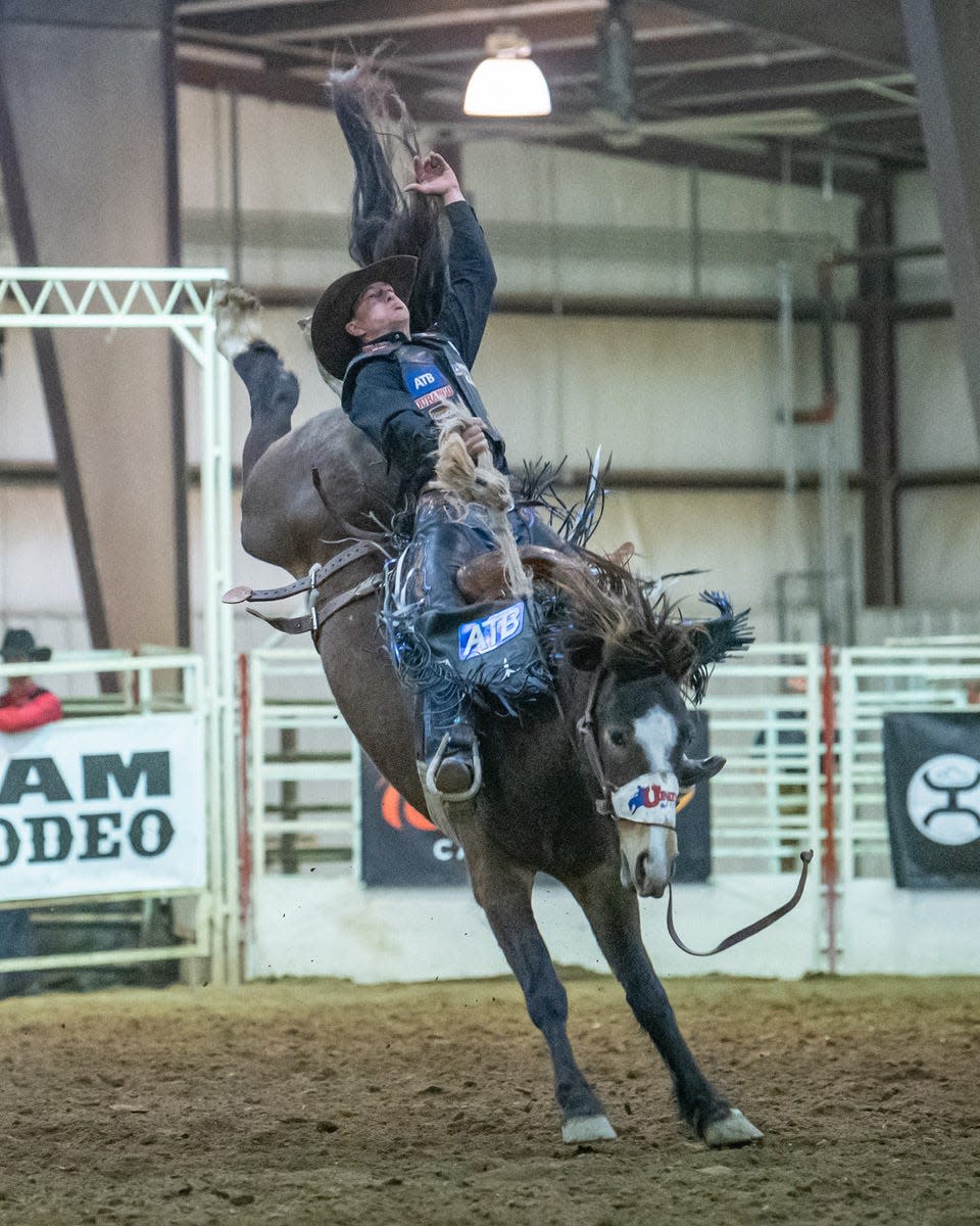 Saddle bronc rider Zeke Thurston, 27, of Big Valley, Alberta, Canada hangs on tight during a ride at the 2022 edition of Osage Xtreme Bronc Days. Thurston is a two-time Professional Rodeo Cowboys Association world champion, having won the saddle bronc title in 2016 and 2019.
