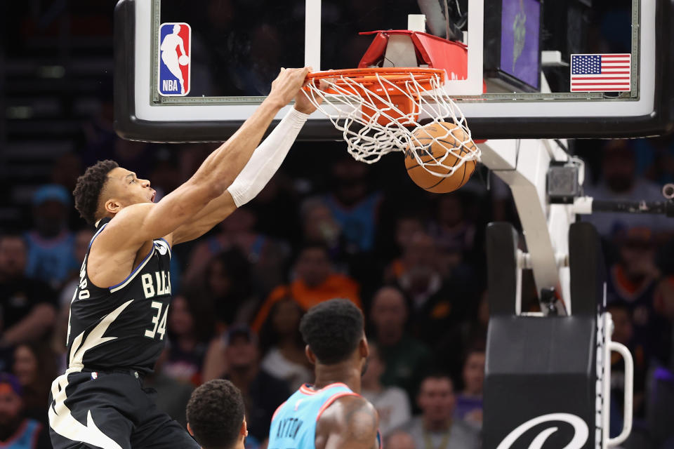 PHOENIX, ARIZONA - MARCH 14: Giannis Antetokounmpo #34 of the Milwaukee Bucks slam dunks the ball against the Phoenix Suns during the first half of the NBA game at Footprint Center on March 14, 2023 in Phoenix, Arizona.   NOTE TO USER: User expressly acknowledges and agrees that, by downloading and or using this photograph, User is consenting to the terms and conditions of the Getty Images License Agreement.  (Photo by Christian Petersen/Getty Images)