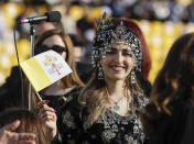 People wait for Pope Francis to celebrate mass at the Franso Hariri Stadium in Irbil, Kurdistan Region of Iraq, Sunday, March 7, 2021. The Vatican and the pope have frequently insisted on the need to preserve Iraq's ancient Christian communities and create the security, economic and social conditions for those who have left to return.(AP Photo/Andrew Medichini)