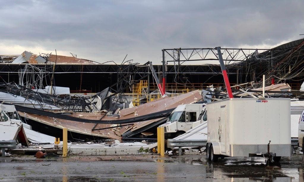 <span>A damaged FedEx facility after a tornado in Portage, Michigan, on 7 May 2024.</span><span>Photograph: Brad Devereaux/AP</span>
