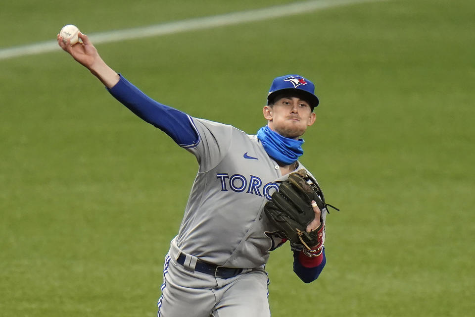 Toronto Blue Jays third baseman Cavan Biggio throws out Tampa Bay Rays' Mike Zunino at first during the fifth inning of Game 1 of a wild card series playoff baseball game Tuesday, Sept. 29, 2020, in St. Petersburg, Fla. (AP Photo/Chris O'Meara)