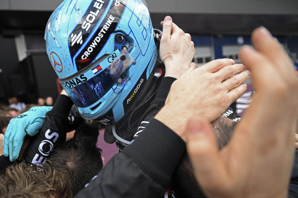Mercedes driver George Russell of Britain celebrates with his team members after winning the Austrian Formula One Grand Prix race at the Red Bull Ring racetrack in Spielberg, Austria, Sunday, June 30, 2024. (AP Photo/Christian Bruna)