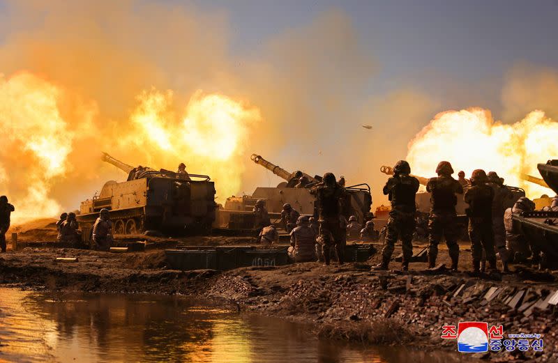 North Korean leader Kim Jong Un guides an artillery firing drill by the Korean People's Army