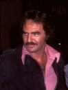 <p>Reynolds dons a devil-may-care pink shirt at the Palm restaurant in Beverly Hills in April 1977.</p>