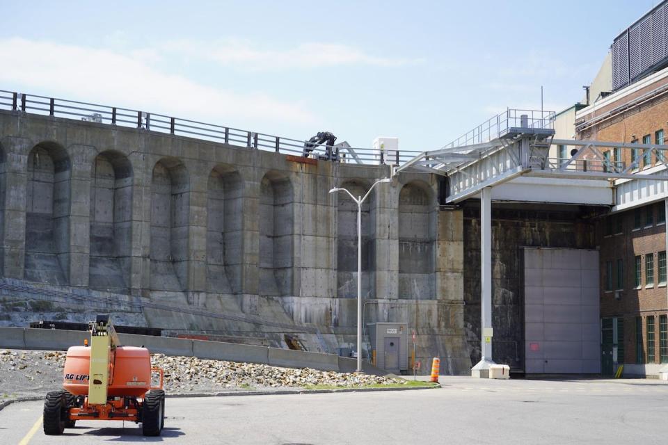 Workers perform maintenance on the Beauharnois Generating Station. Improvements to existing dams is part of Hydro-Quebec's attempt to increase electricity production.