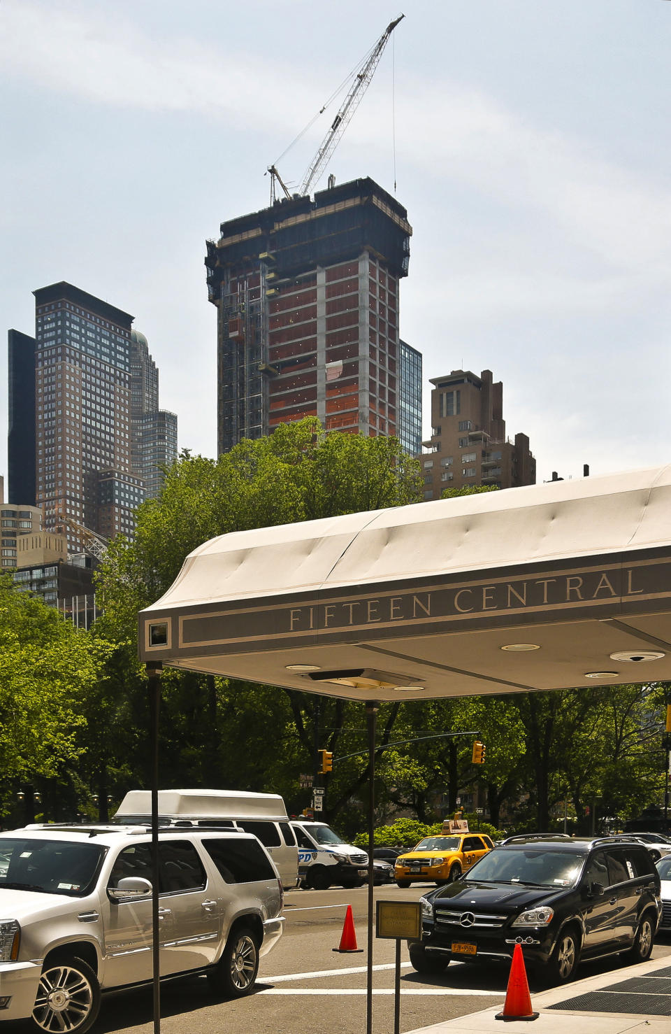 FILE - In this May 26, 2016 file photo, a crane sits atop ongoing construction for a new condominium skyscraper at 220 Central Park South in New York. Citadel hedge fund founder Ken Griffin, a billionaire hedge fund founder, has purchased a penthouse in New York for roughly $238 million. The Wall Street Journal reported Wednesday, Jan. 23, 2019, that the deal sets a record for the highest-priced home ever sold in the U.S. (AP Photo/Bebeto Matthews, File)